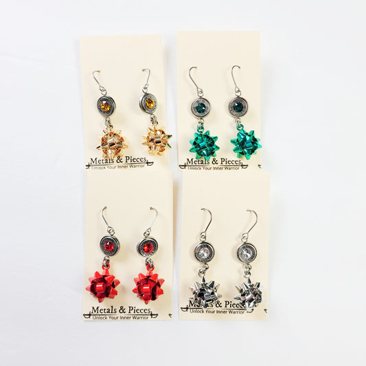 Gun-themed Christmas earrings in red, green, gold, and silver