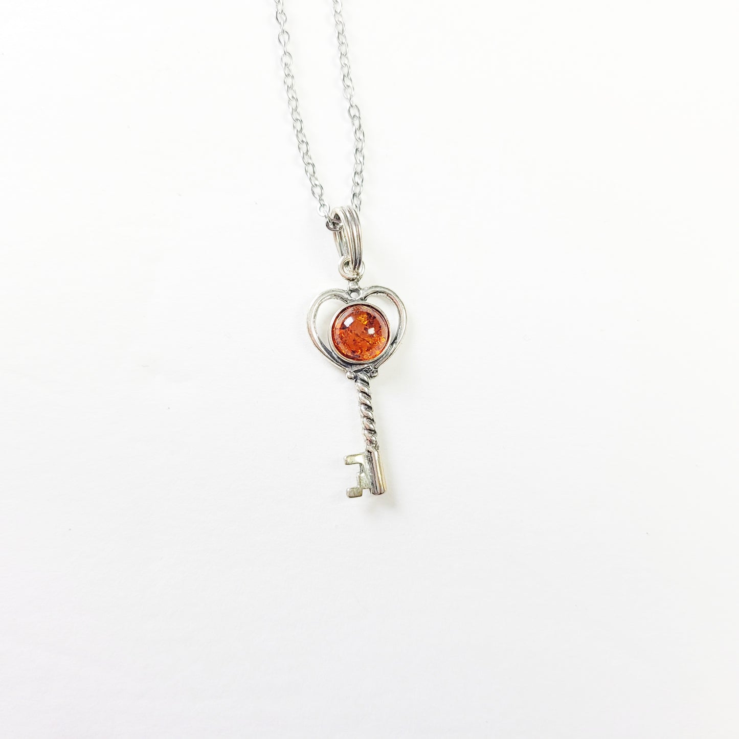 Sterling silver key necklace with Baltic amber pendant