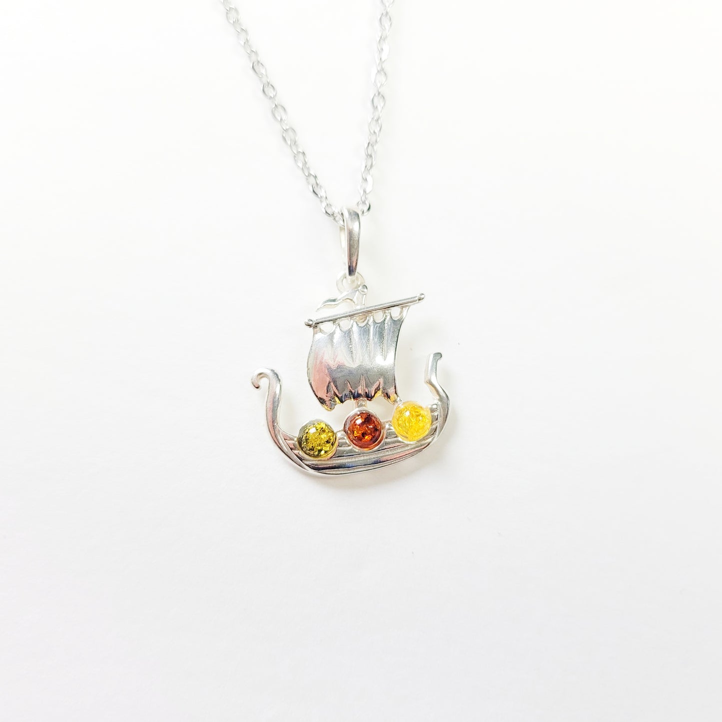 Sterling silver Viking ship necklace with Baltic amber