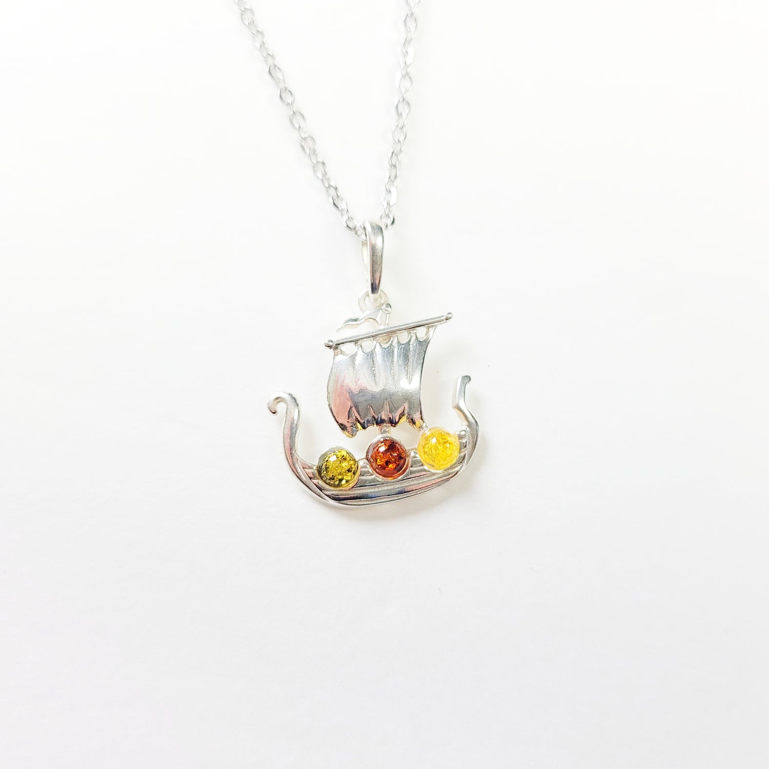 Sterling silver Viking ship necklace with Baltic amber