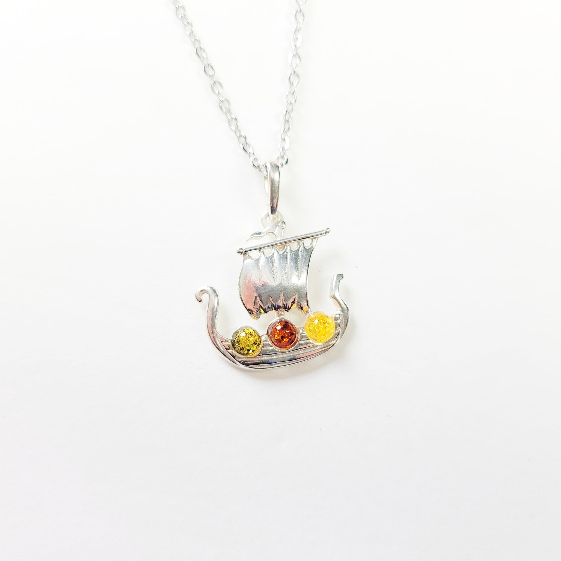 Sterling silver Viking ship necklace with Baltic amber