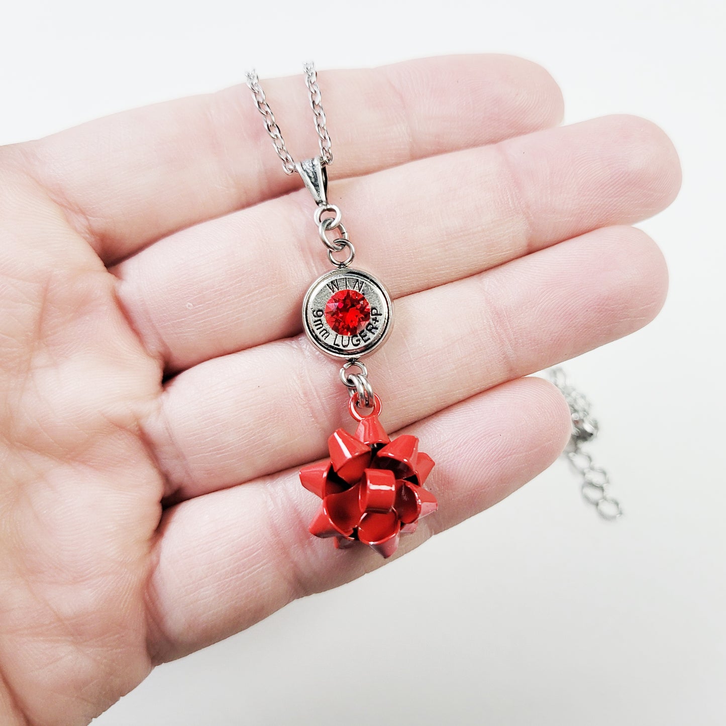 Bullet bow necklace with 9mm casing and metal bow